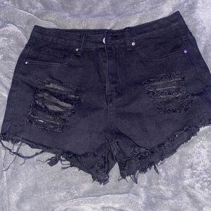 black ripped shorts